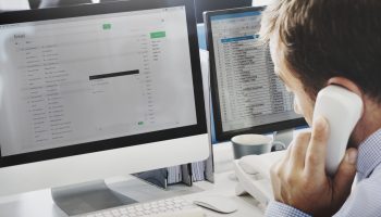 A man is writing an e-mail