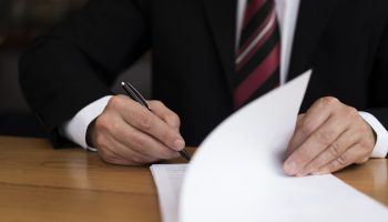 unrecognisable-business-man-writing-front-view